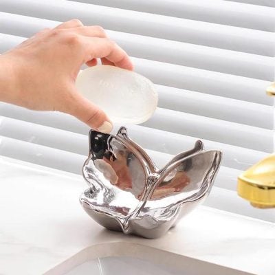 Luxurious soap in a decorative butterfly-shaped dish at Monalisa Store for premium skincare. Perfect for skincare routines and home decor.