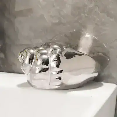 Luxury silver decorative vase with an abstract design for modern home decor.