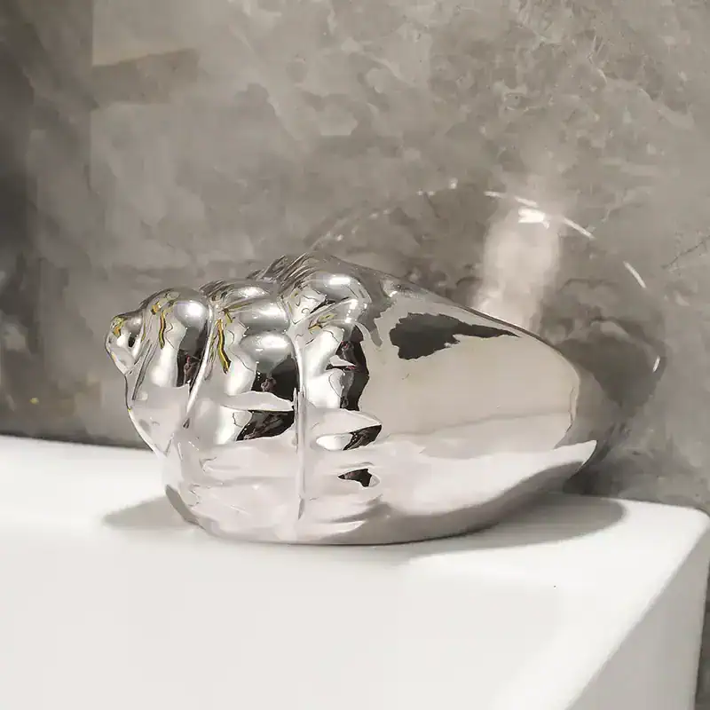Luxury silver decorative vase with an abstract design for modern home decor.