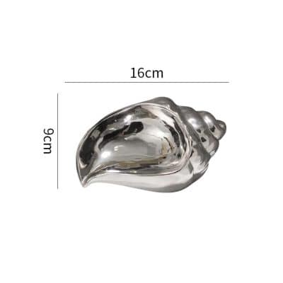 Shiny silver shell-shaped jewelry dish, 16cm x 9cm, perfect for storing small accessories or trinkets at Monalisa Store. Elegant, modern design ideal for home or office decor.