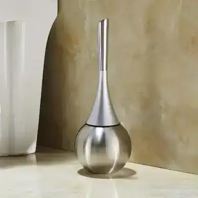 Metallic silver perfume atomizer with sleek, modern design for luxury fragrance storage and display.