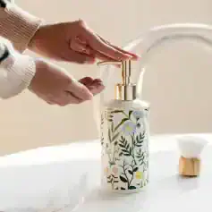 Sanitary hand soap dispenser with floral design, perfect for bathroom or kitchen use. Elegant and functional, ideal for maintaining hygiene and adding aesthetic appeal to your space.