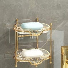 Elegant two-tier glass and gold-finished bathroom storage shelf for organizing toiletries at Monalisa Store.
