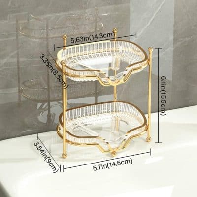Elegant gold and glass two-tier fruit and dessert stand, perfect for home decor, parties, and serving. Stylish and functional, ideal for displaying snacks, desserts, or decorative items in a luxurious setting.