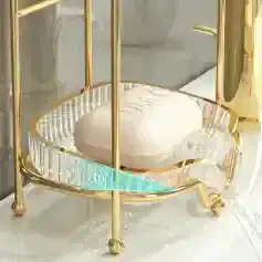 Luxurious gold and crystal soap dish with a sleek modern design, perfect for upscale bathroom decor and elegant soap storage solutions.