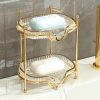 Luxurious gold and glass soap dish holder with monogrammed soap bars, designed for elegant bathrooms, featuring a two-tier design and crystal accents for a sophisticated aesthetic.