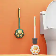 Colorful handheld infrared thermometers with playful paw-shaped designs for kids, mounted on a vibrant orange wall near a modern toilet, promoting fun and hygienic health monitoring.