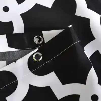 Black and white fabric with grommets, modern design, versatile textile product - perfect for fashion, accessories, or interior decor. High-quality material used for stylish and durable applications.