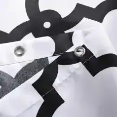 Black and white patterned fabric with metal eyelets, likely a protective or promotional banner for Monalisa Store's optometry and eyewear products.