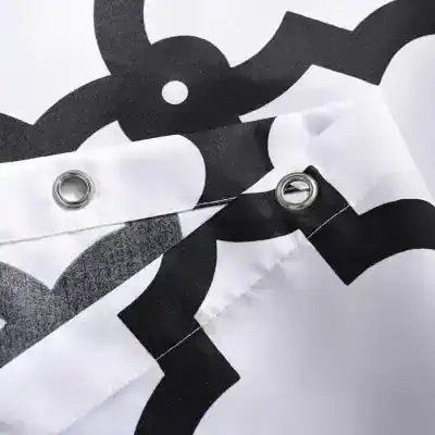 Black and white patterned fabric with metal eyelets, likely a protective or promotional banner for Monalisa Store's optometry and eyewear products.