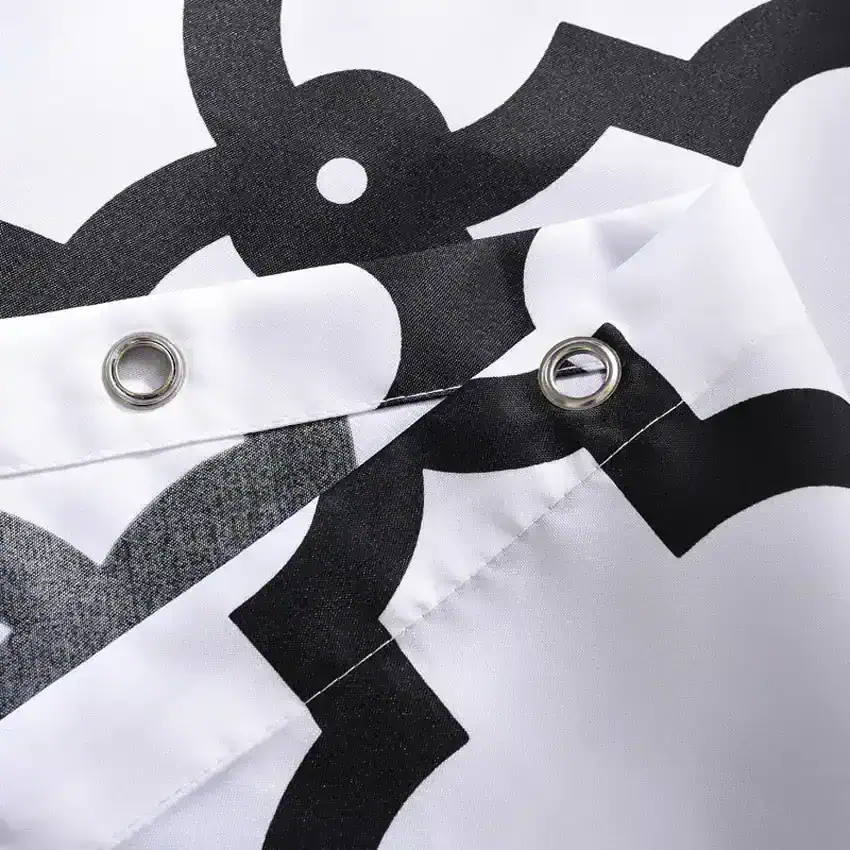Black and white patterned fabric with metal eyelets, likely a protective or promotional banner for Monalisa Store's optometry and eyewear products.