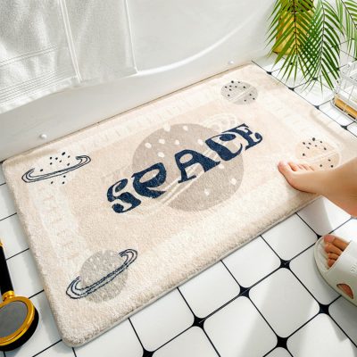 Cosmic space themed bathroom rug with planets and stars, playful design, soft plush texture, ideal for children’s bathroom decor, featuring the word