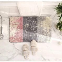 Luxury bathroom rug with modern abstract design, soft plush slippers, and elegant marble flooring, perfect for contemporary home decor and comfort.