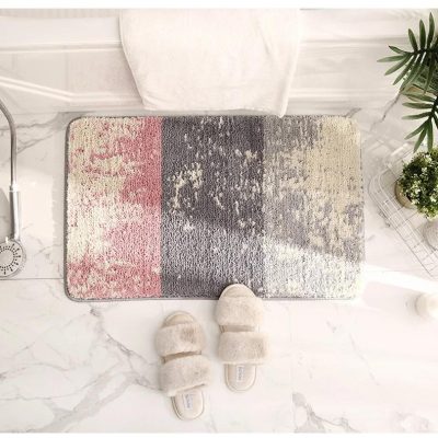 Luxury bathroom rug with modern abstract design, soft plush slippers, and elegant marble flooring, perfect for contemporary home decor and comfort.