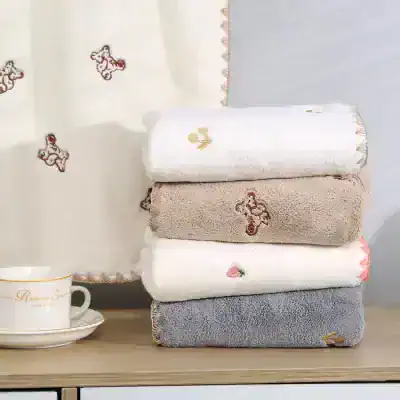 Soft embroidered towels with floral and animal designs, perfect for luxury bathroom decor at Monalisa Store.