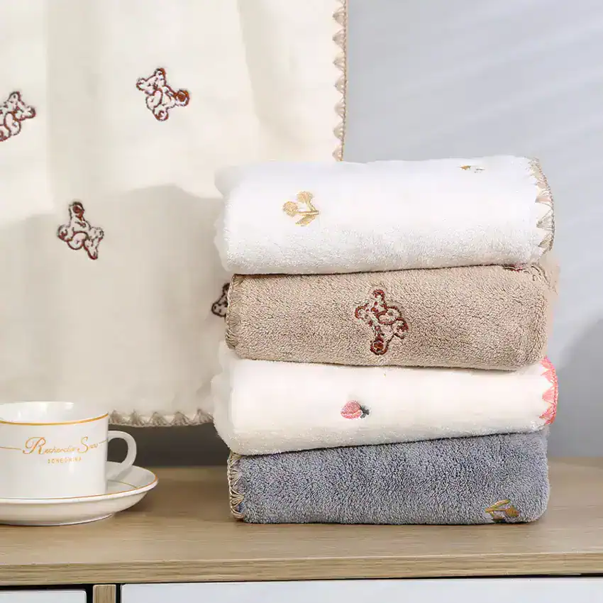 Soft embroidered towels with floral and animal designs, perfect for luxury bathroom decor at Monalisa Store.
