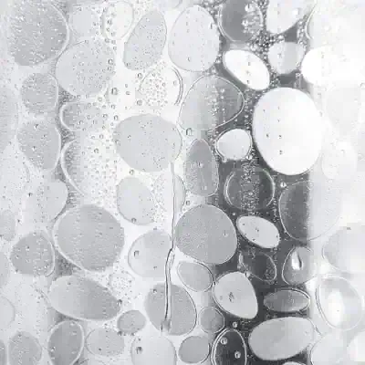 Oil and vinegar bubbles on glass surface.