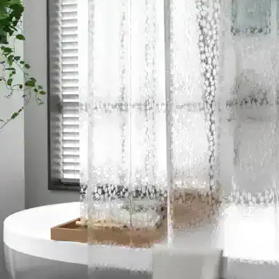 Soft white lace curtain with circular pattern, providing privacy and elegant decor for the bedroom or living space.