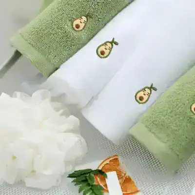 Luxury embroidered spa towels with avocado logo and soft texture for skincare and wellness routines at monalisa store.
