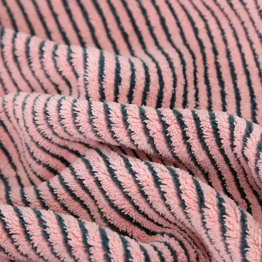 Soft pink and navy striped plush fabric, perfect for cozy clothing and accessories, showcasing high-quality, comfortable textile material from Monalisa Store.