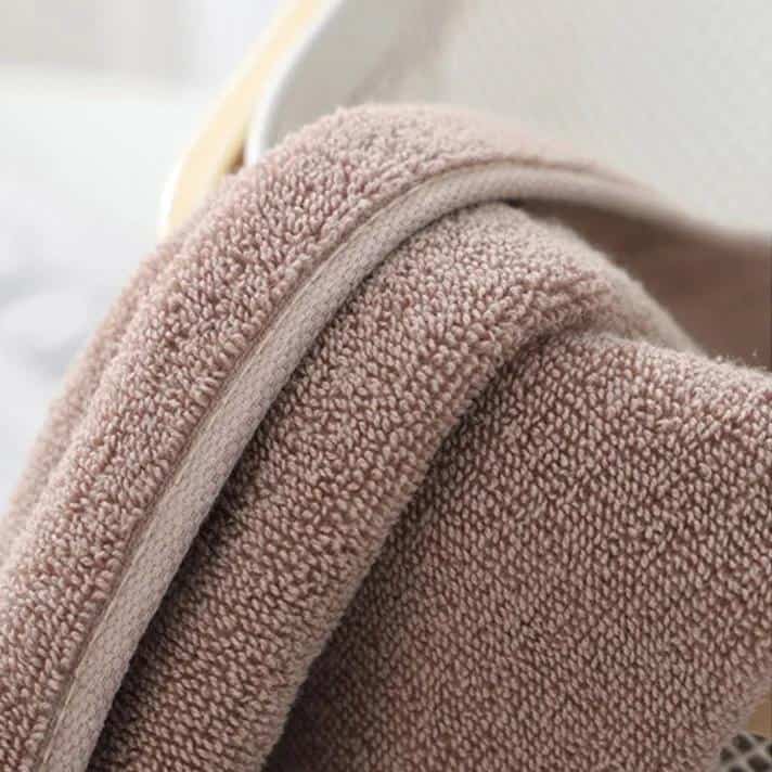Soft beige terrycloth towel with plush texture, ideal for personal care and relaxation at Monalisa Medical Store.