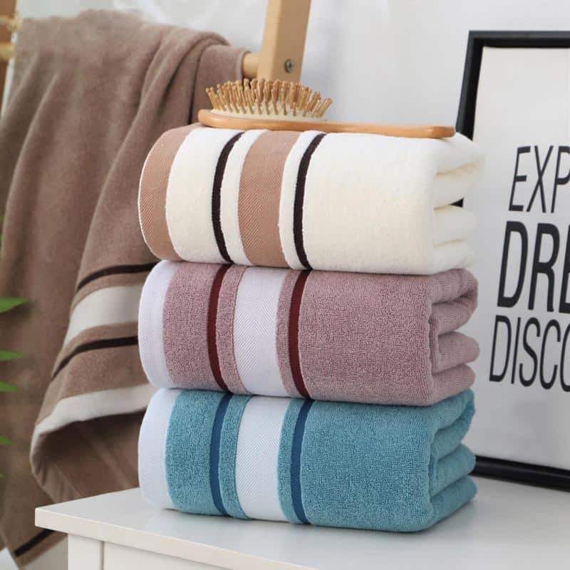 Soft, colorful towels neatly stacked at Monalisa Medical Store, ideal for luxury bathroom and skincare routines, offering comfort and elegance.