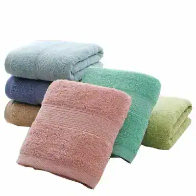Soft pastel-colored bath towels set on a white background, perfect for luxury hotel or home use, showcasing high-quality cotton and plush texture.