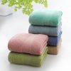 Vibrant stack of plush, colorful towels on white background, ideal for spa, beauty, or opt clinic decor. Perfect for creating a relaxing atmosphere with high-quality textiles.