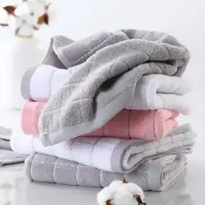 Luxury microfiber towels folded in neutral colors at Monalisa Store for premium skincare and spa use.