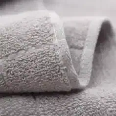 Luxury gray towel set with embroidered logo, monalisa store, high-quality hotel-style linens, plush bath towels, soft and absorbent, perfect for home or spa use, premium textile products for comfort and style.