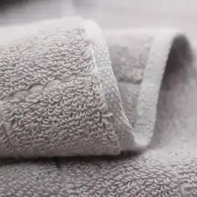 Luxury gray towel set with embroidered logo, monalisa store, high-quality hotel-style linens, plush bath towels, soft and absorbent, perfect for home or spa use, premium textile products for comfort and style.