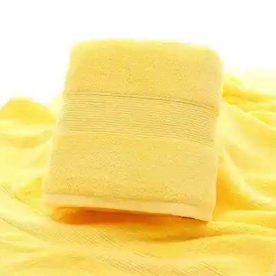 Soft yellow towel showcasing plush texture, perfect for spa, bath, and skincare routines, emphasizing comfort and luxury. Ideal for wellness and beauty settings.