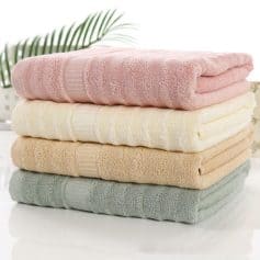 Soft pastel-colored towels stacked for display.
