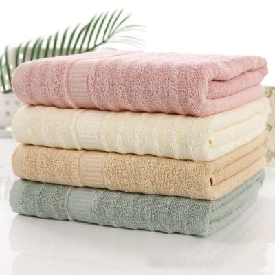 Soft pastel-colored towels stacked for display.