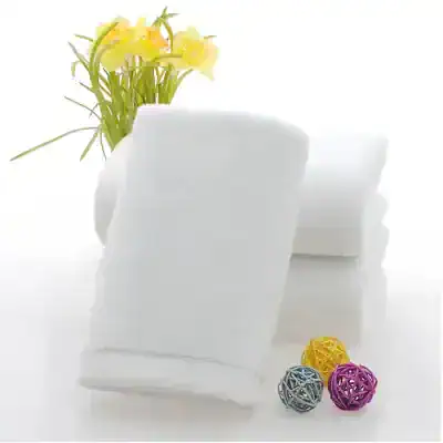 White medical bandages and sponge pads for eye care treatment with decorative balls and yellow flowers in a white vase at Monalisa Store.