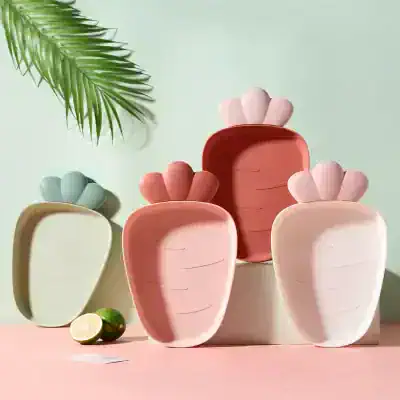 Colorful ceramic vase collection with carrot-shaped design, perfect for home decor and styling in modern living spaces. Bright pastel colors and playful shapes add a fresh aesthetic.