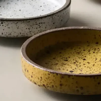Ceramic speckled bowls set for kitchen or dining decor, modern and stylish tableware collection for home use.