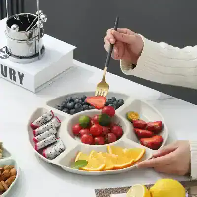 Fresh fruit platter with blueberries, cherry tomatoes, dragon fruit, orange slices, and strawberries for healthy snacking at Monalisa Store.