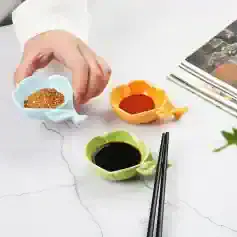 Seasoning bowls with soy sauce, chili powder, and spices for Asian cuisine, in colorful ceramic cups, on a white textured surface, emphasizing culinary ingredients for cooking, Monalisa Store.