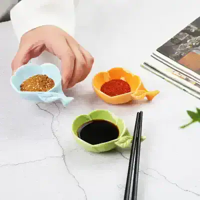 Seasoning bowls with soy sauce, chili powder, and spices for Asian cuisine, in colorful ceramic cups, on a white textured surface, emphasizing culinary ingredients for cooking, Monalisa Store.