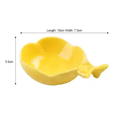 Bright yellow ceramic dish shaped like a lemon with a lemon peel handle, ideal for home decor or serving small snacks, from Monalisa Store.