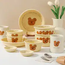 Cute teddy bear themed ceramic dinnerware set from Monalisa Store, ideal for children's dining, featuring plates, bowls, and mugs with playful bear designs.