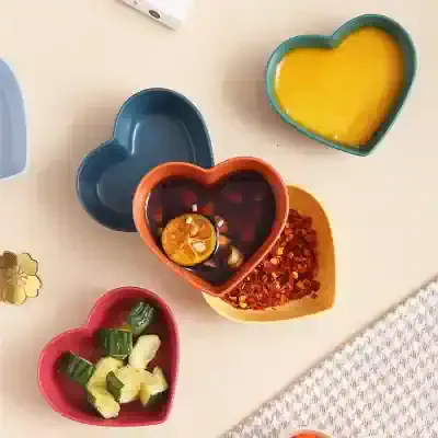 Vibrant heart-shaped bowls with condiments and garnishes for healthy eating or spa treatments at Monalisa Store.
