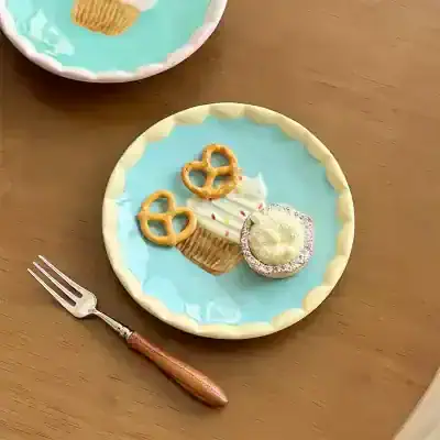 Miniature dessert plate with a cupcake, pretzels, and a cookie, perfect for dolls or collectibles. Bright pastel colors and detailed handcrafted design. A charming addition to any dollhouse or display collection.