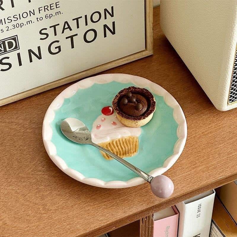 Mini dessert on a colorful plate at Monalisa Store, showcasing delicious sweet treats and cozy ambiance for a delightful shopping experience.