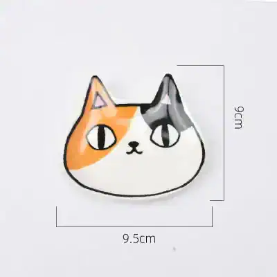 Colorful cat face badge, playful design with orange, black, and white details, perfect for accessories, clothing, and optical-themed decor.