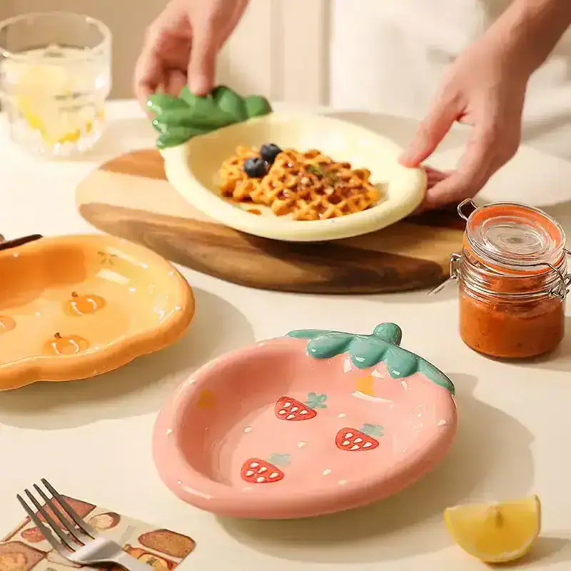 Handmade ceramic strawberry-shaped bowls for salads, desserts, or snacks, featured at Monalisa Store. Perfect for adding a charming touch to your tableware collection.