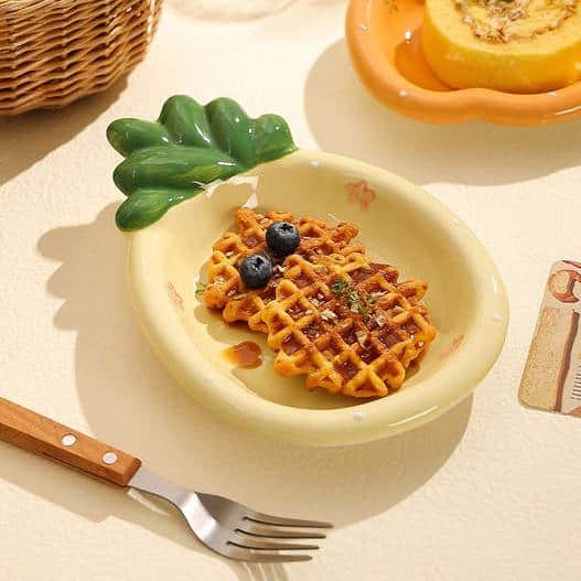 Crispy waffle with blueberries on a decorative plate, healthy breakfast option, Monalisa Store, delicious waffle breakfast, fruit and waffle dish.