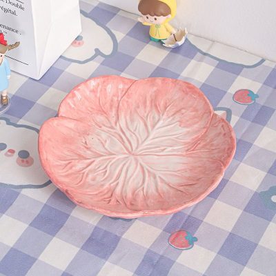 Ceramic peach-shaped dish bowl, decorative kitchenware for fruit or snack display, perfect for modern homes and table decor.