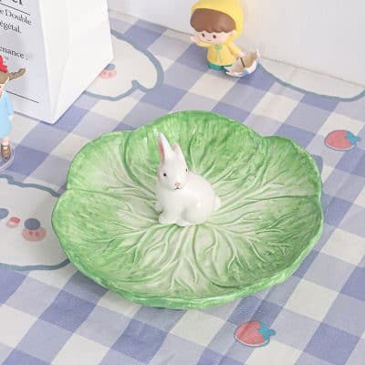 Cute ceramic rabbit on a leafy green dish, perfect for home decor or as a decorative bowl, available at Monalisa Store for animal-themed kitchen accessories.